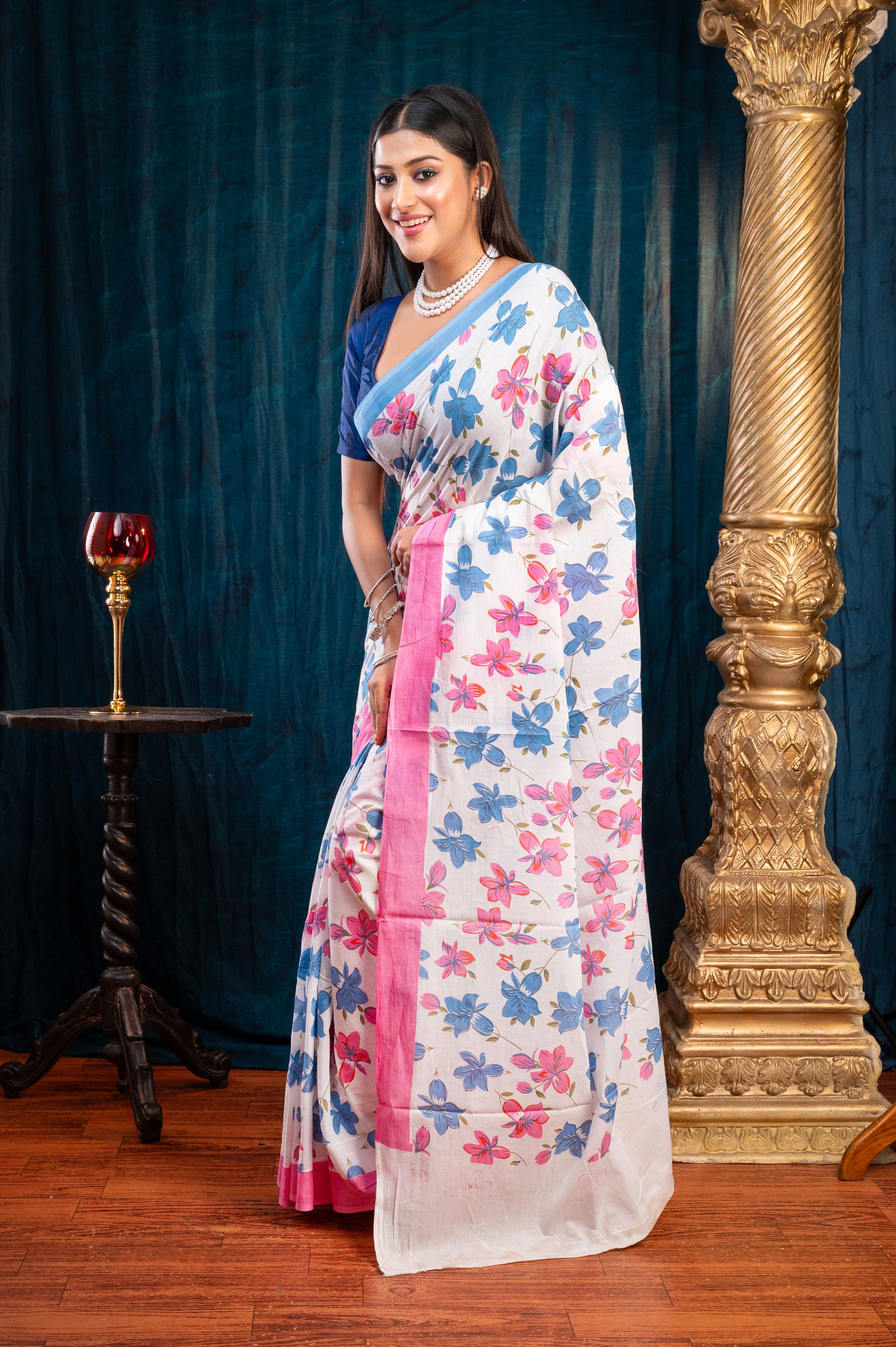 Women Off-White Pure Bagru Malmal Cotton Saree With Pink And Blue Flower Print